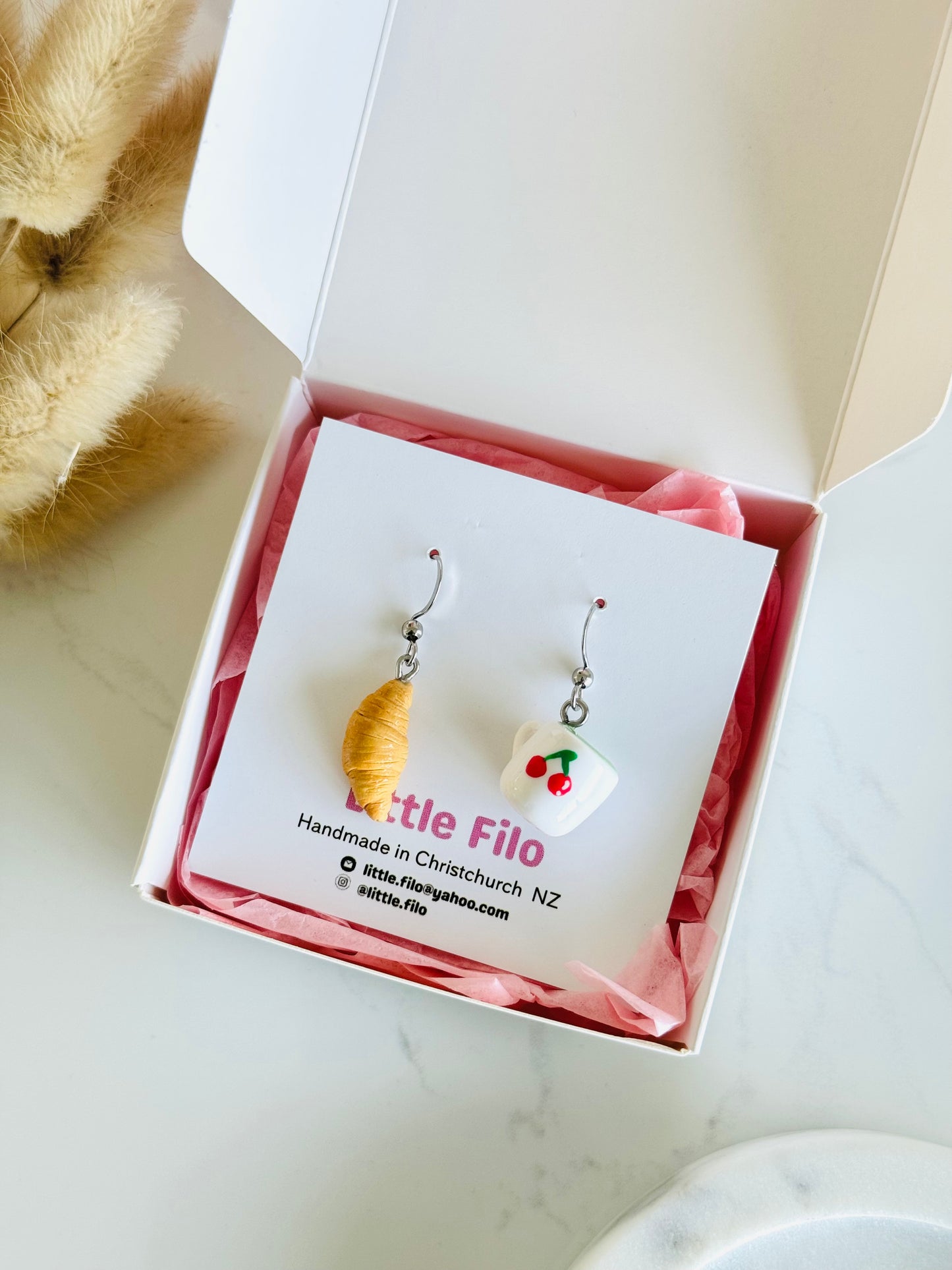 Handmade polymer clay matcha and croissant earrings NZ, mismatched food jewelry