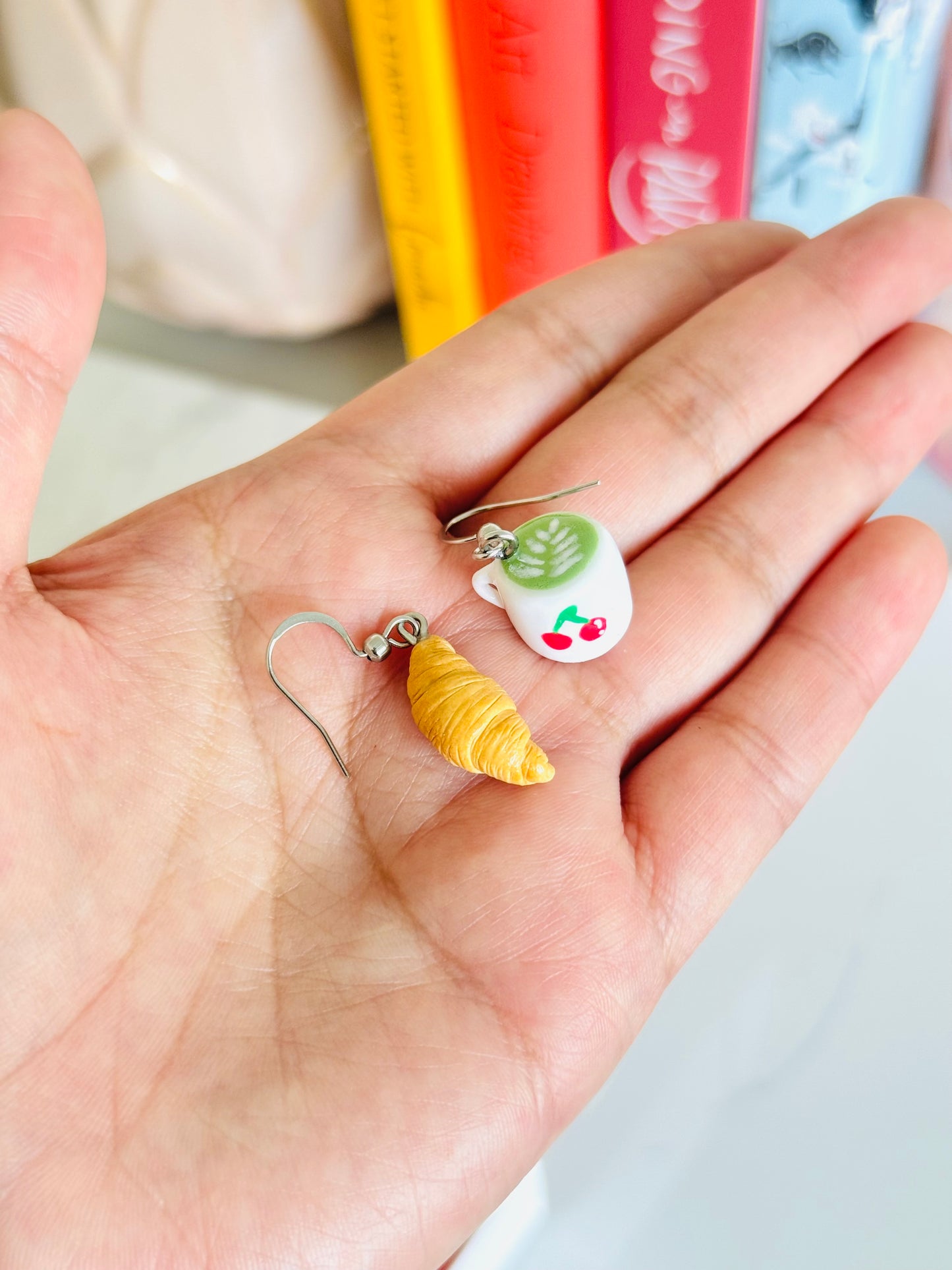 Handmade polymer clay matcha and croissant earrings NZ, mismatched food jewelry
